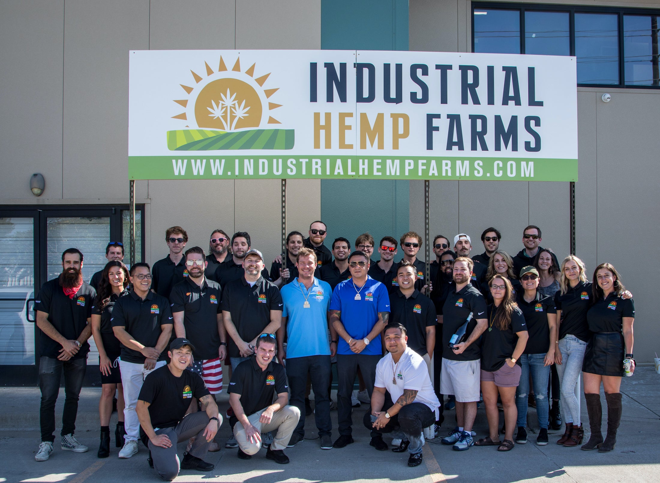 Industrial Hemp Farms team outside the company building