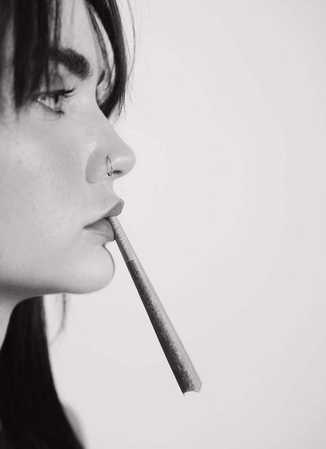 Black and white close portrait with a flower pre-roll